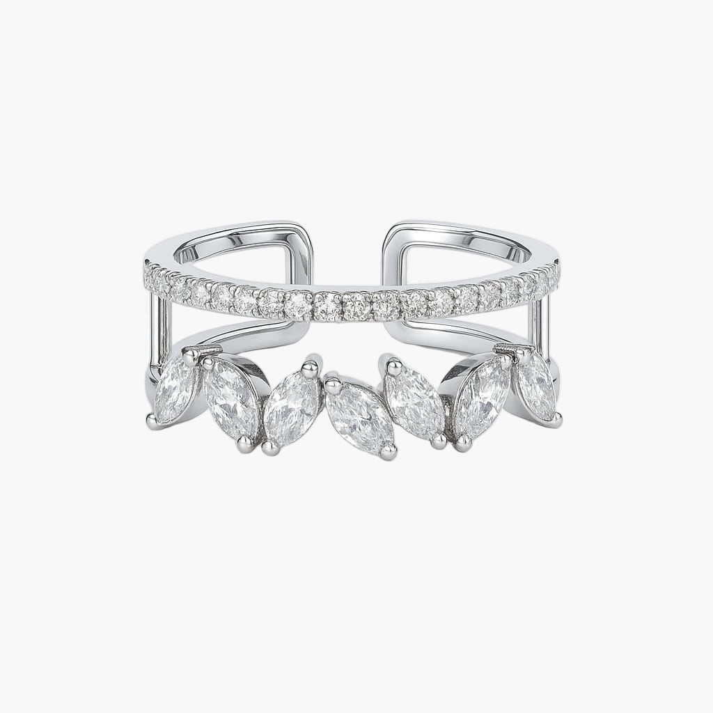 Silver ring with marquise-shaped gemstones on a white background