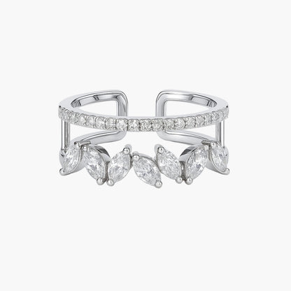 Silver ring with marquise-shaped gemstones on a white background