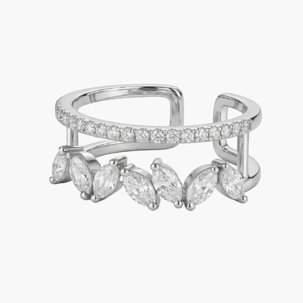 Silver ring with marquise-shaped gemstones on a white background