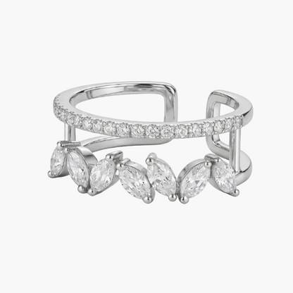 Silver ring with marquise-shaped gemstones on a white background