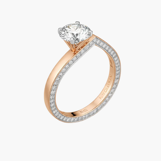 Rose gold ring with a large diamond and smaller diamonds on the band against a white background