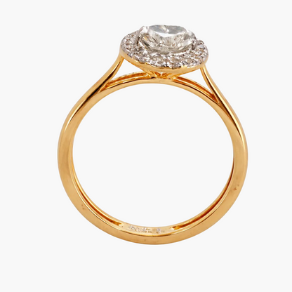 Gold ring with a diamond on a white background