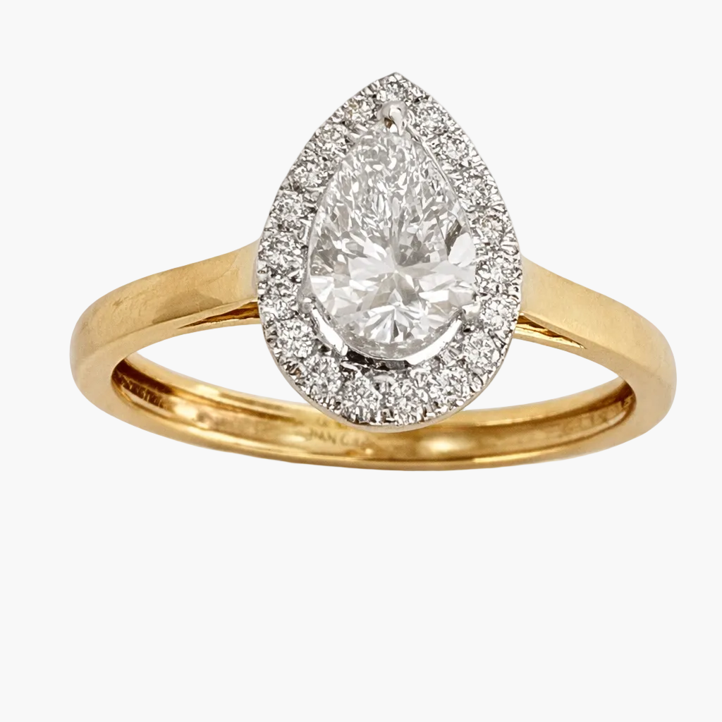 Gold ring with a pear-shaped diamond and halo on a white background
