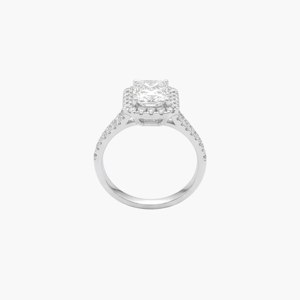 Silver ring with a diamond halo on a white background