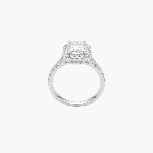 Silver ring with a diamond halo on a white background