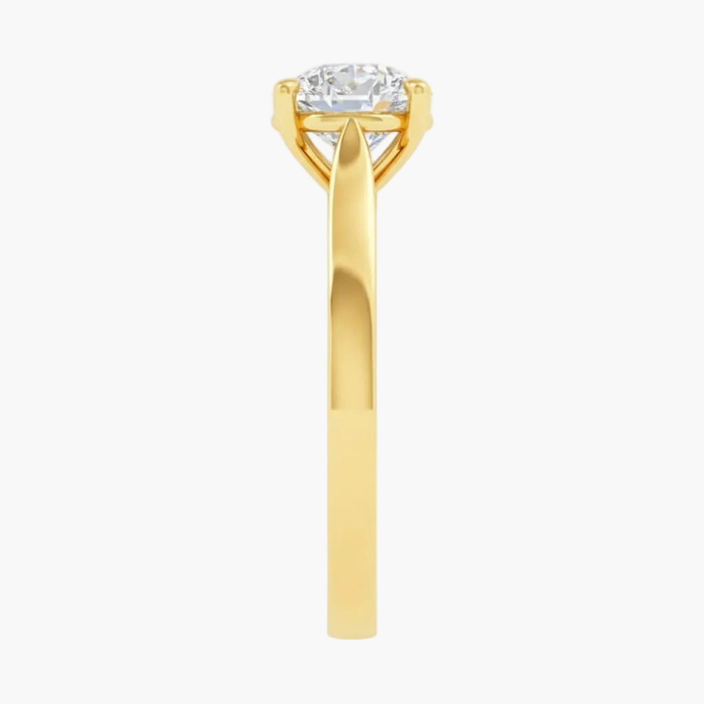 Gold ring with a diamond on a white background