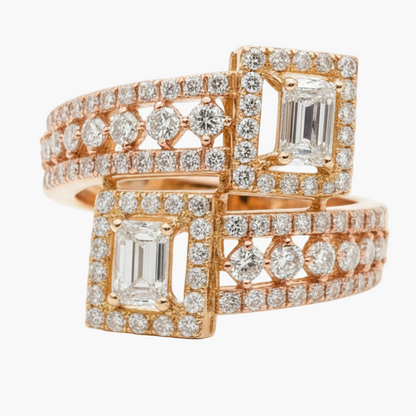 Rose gold ring with emerald-cut diamonds on a white background
