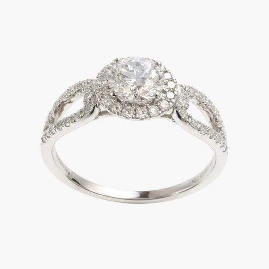 Silver ring with a large diamond and smaller diamonds on a white background