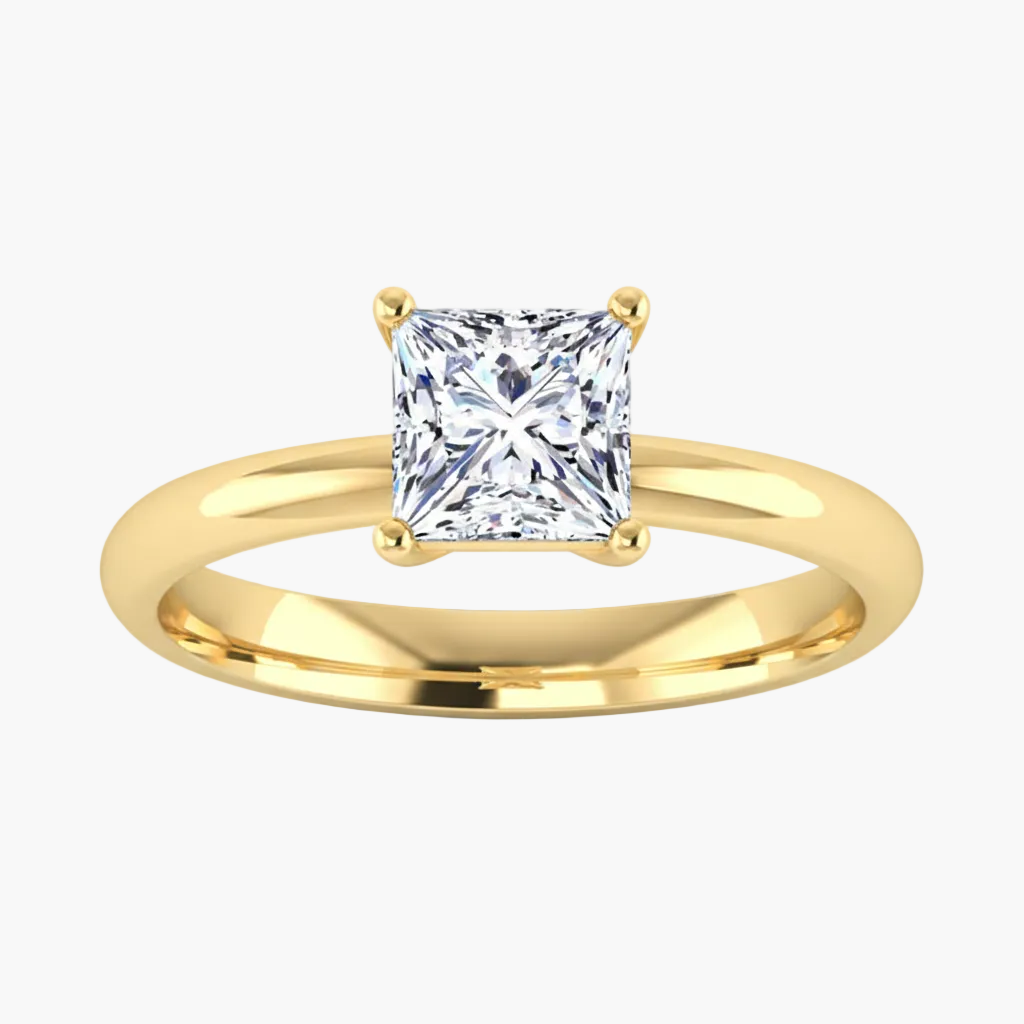 Gold ring with a princess-cut diamond on a white background