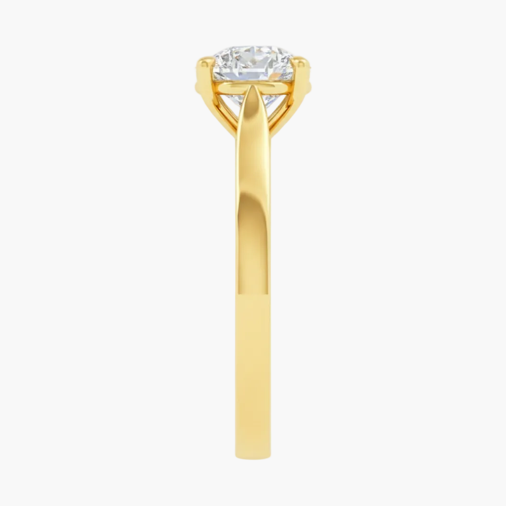 Gold ring with a diamond on a white background