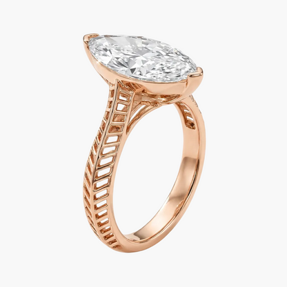 Rose gold ring with a large diamond on a white background