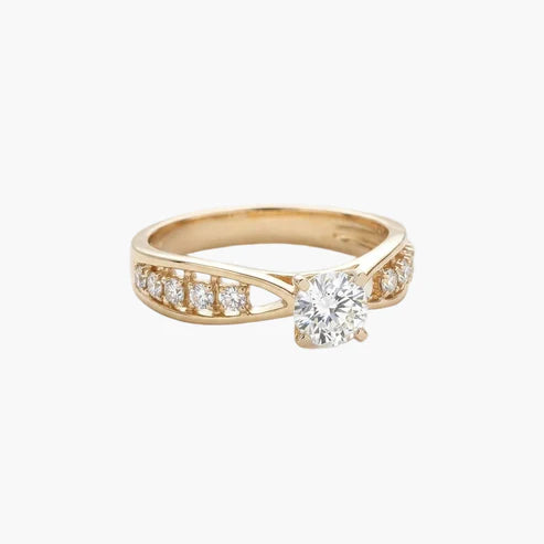 Gold ring with a diamond on a white background