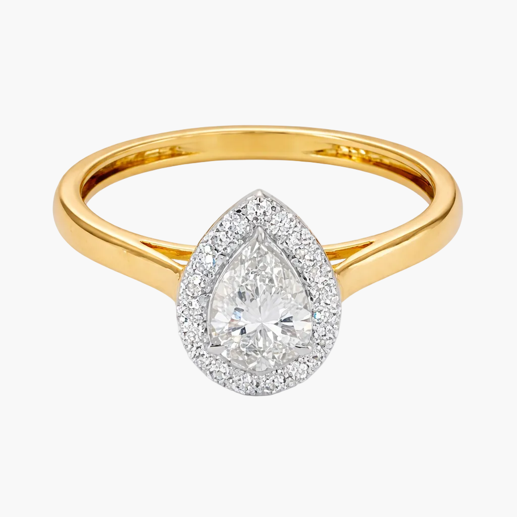 Gold ring with a pear-shaped diamond on a white background