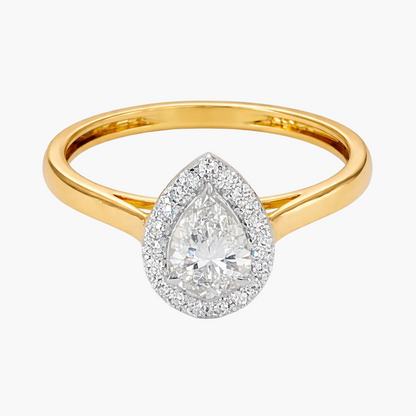 Gold ring with a pear-shaped diamond on a white background