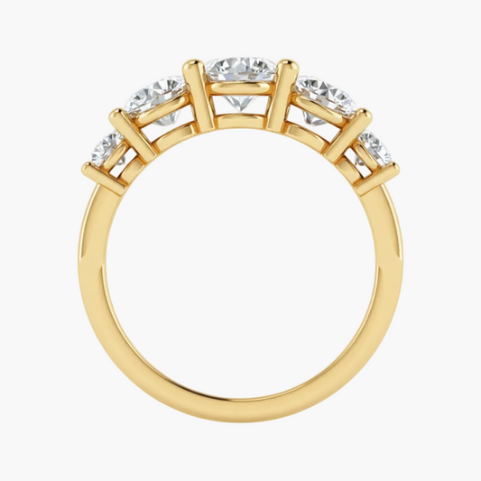 Gold ring with diamonds on a white background