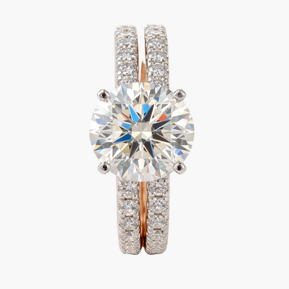 Diamond ring with rose gold band on a white background