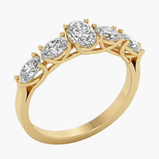 Gold ring with five diamonds on a white background