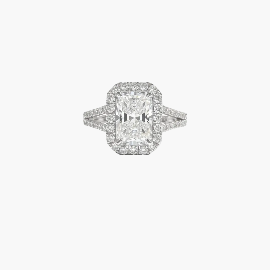 Diamond ring with a rectangular center stone on a white background