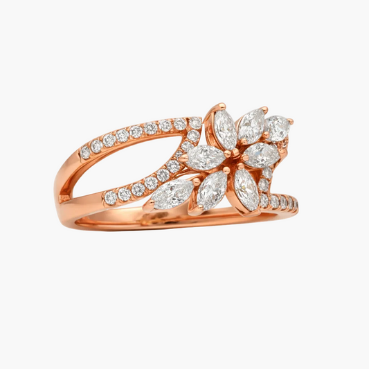 Rose gold ring with diamond accents on a white background