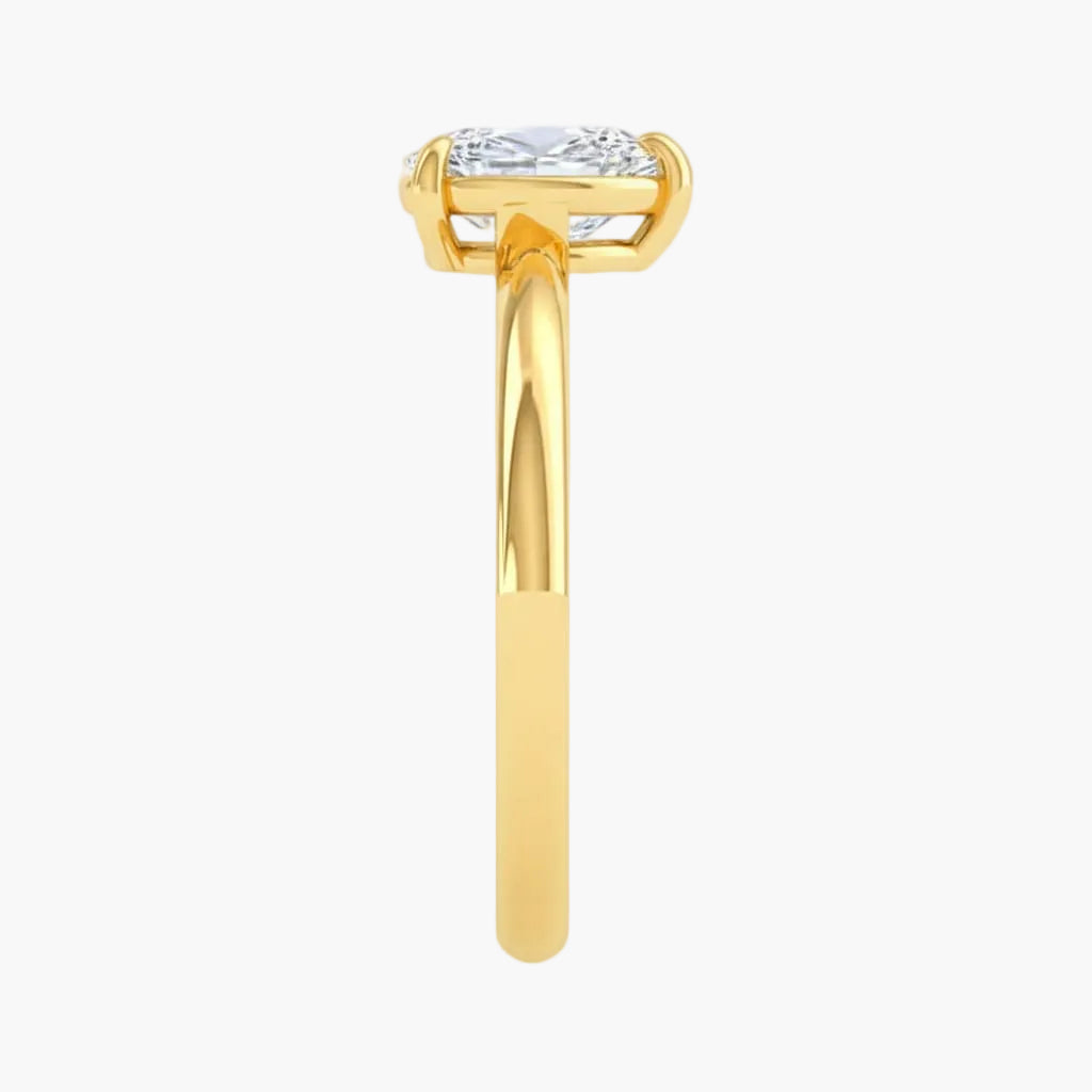 Gold ring with a diamond on a white background