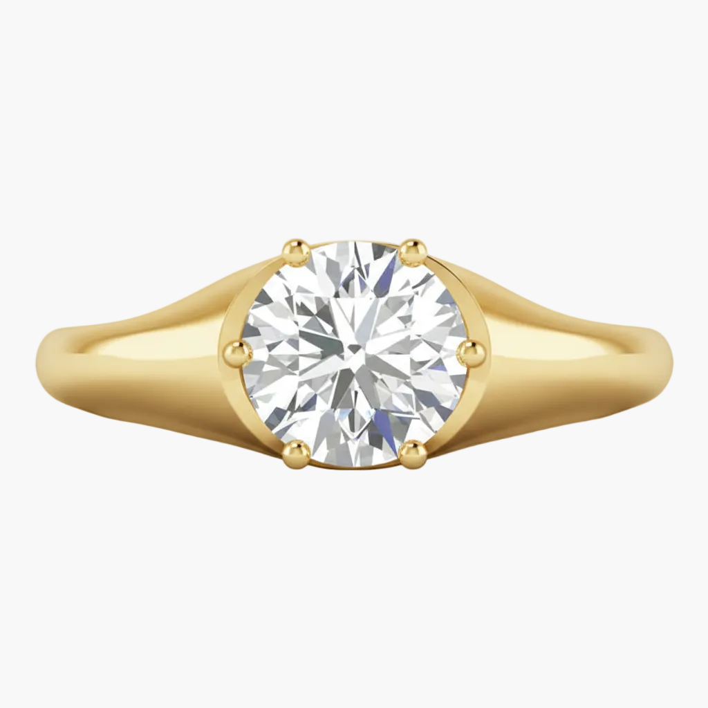 Gold ring with a diamond on a white background
