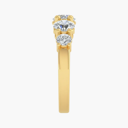 Gold ring with two diamonds on a white background