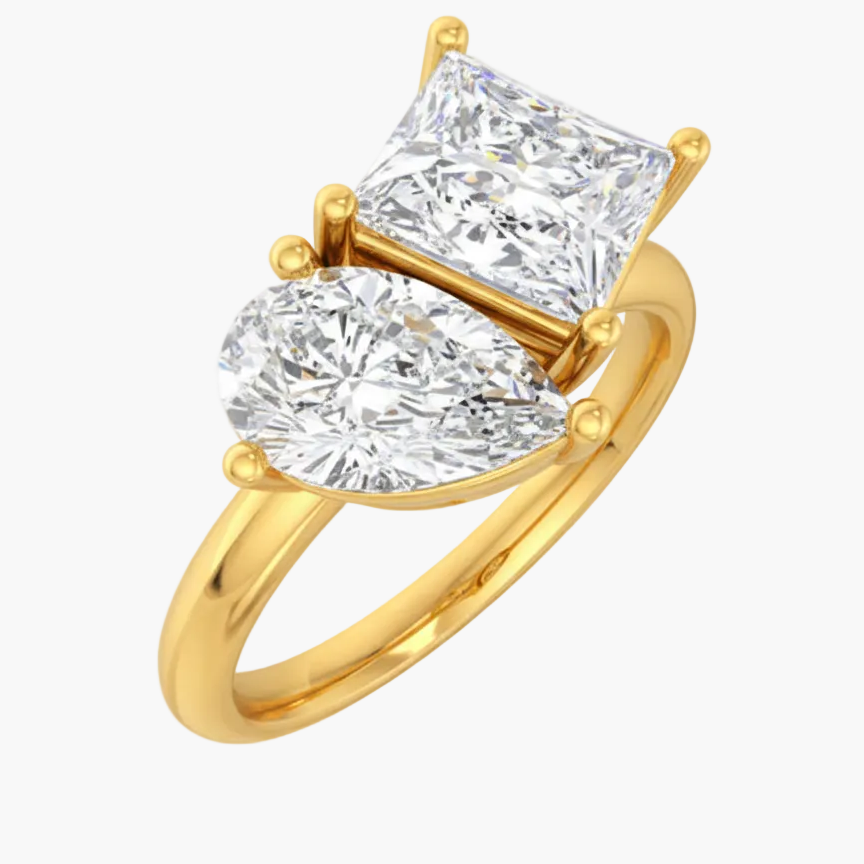 Gold ring with two large diamonds on a white background