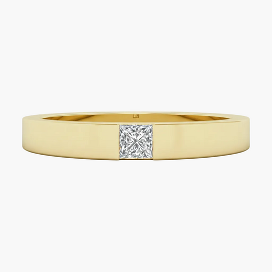 Gold ring with a diamond on a white background
