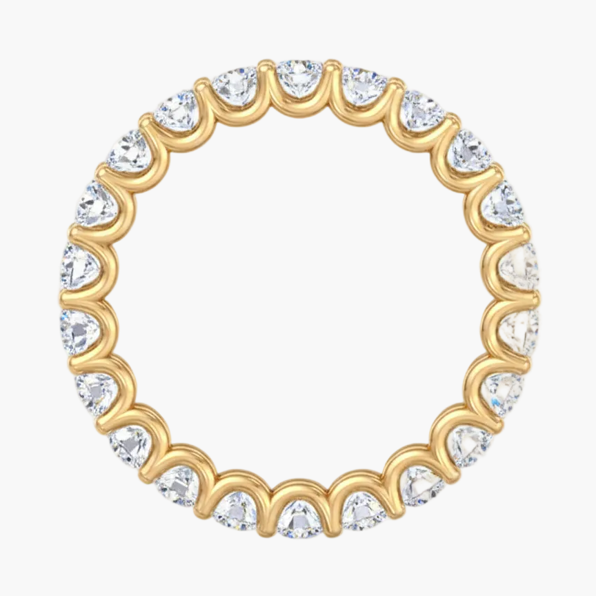 Gold ring with clear gemstones on a white background