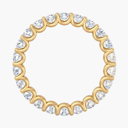 Gold ring with clear gemstones on a white background