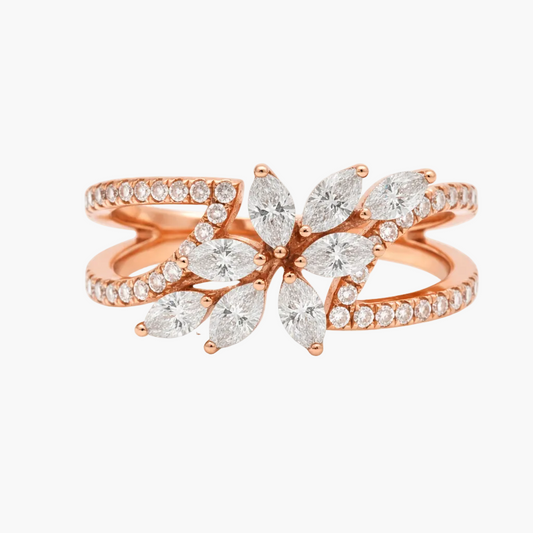 Rose gold ring with diamond leaves on a white background