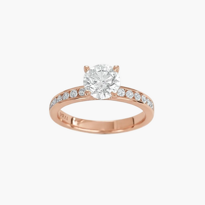 Rose gold ring with a diamond on a white background
