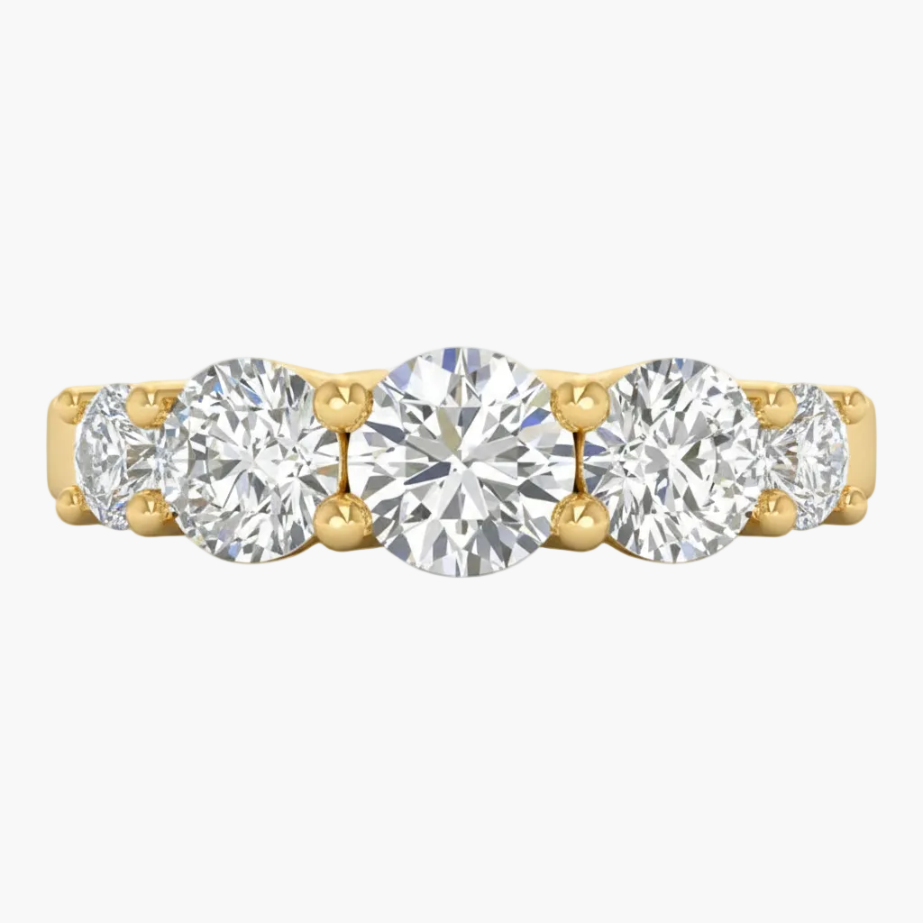 Gold ring with five round diamonds on a white background