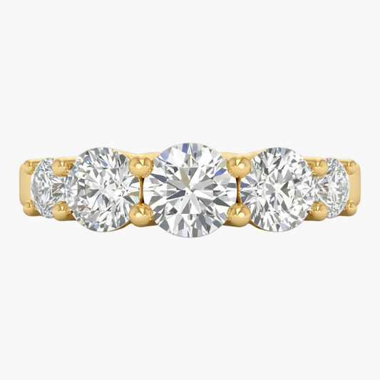 Gold ring with five round diamonds on a white background