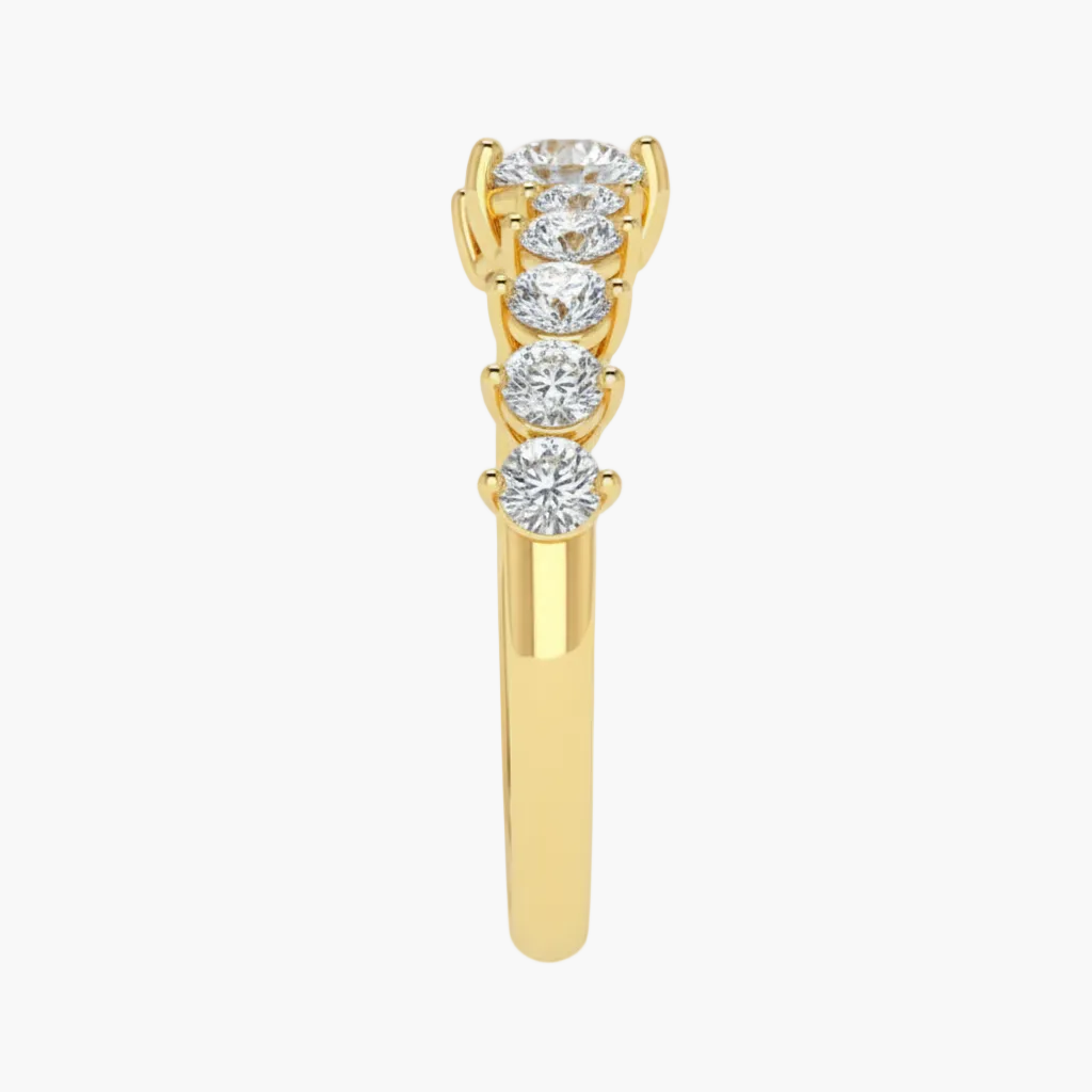 Gold ring with diamond stones on a white background