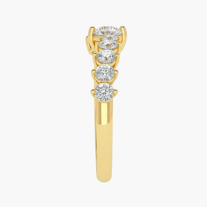Gold ring with diamond stones on a white background