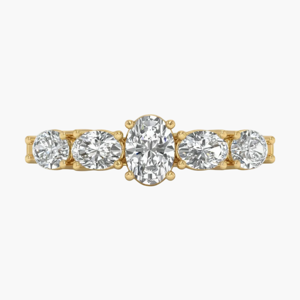 Gold ring with five diamonds on a white background