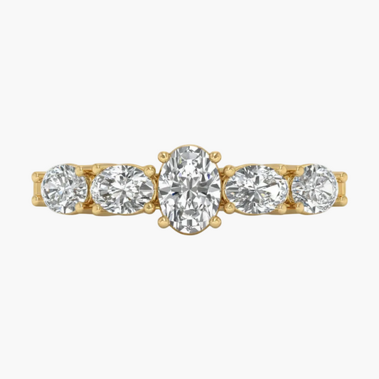Gold ring with five diamonds on a white background