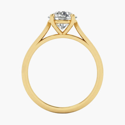 Gold ring with a diamond on a light gray background