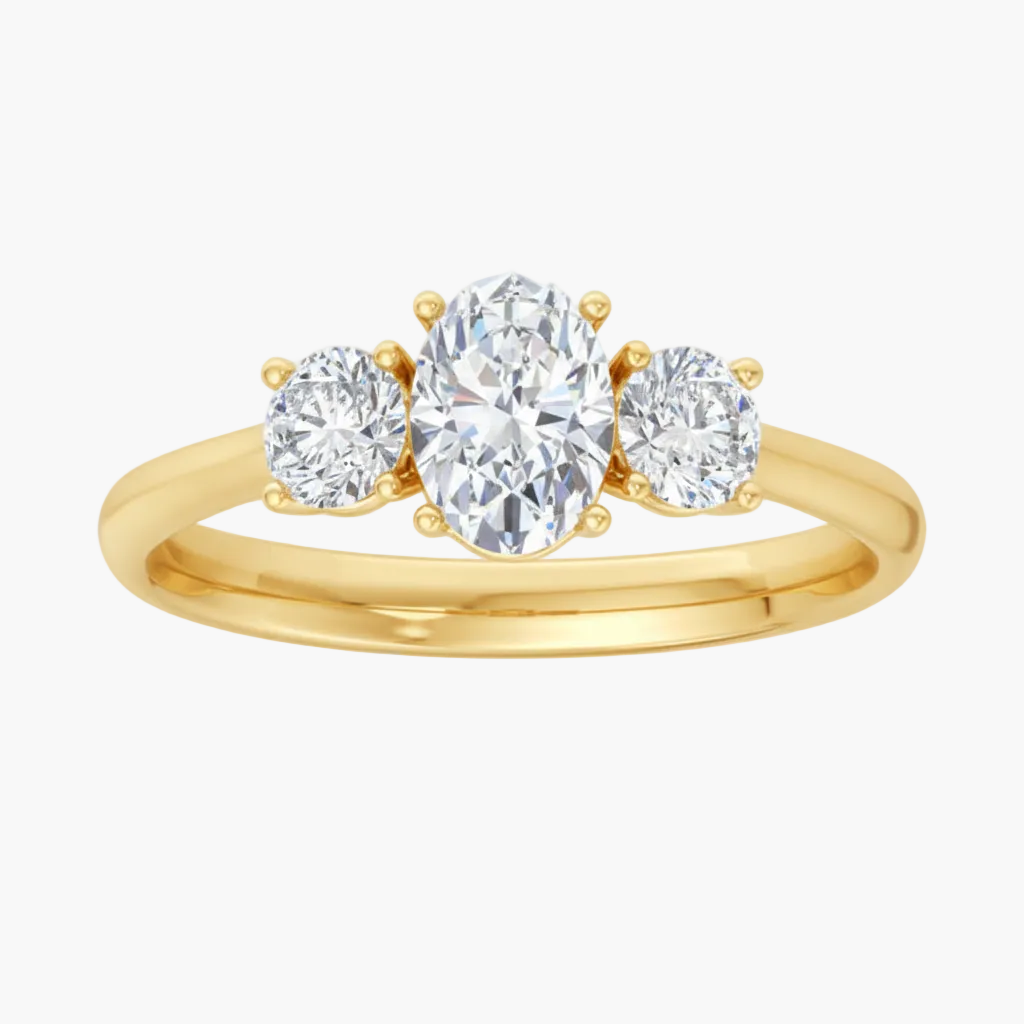 Gold ring with three diamonds on a white background
