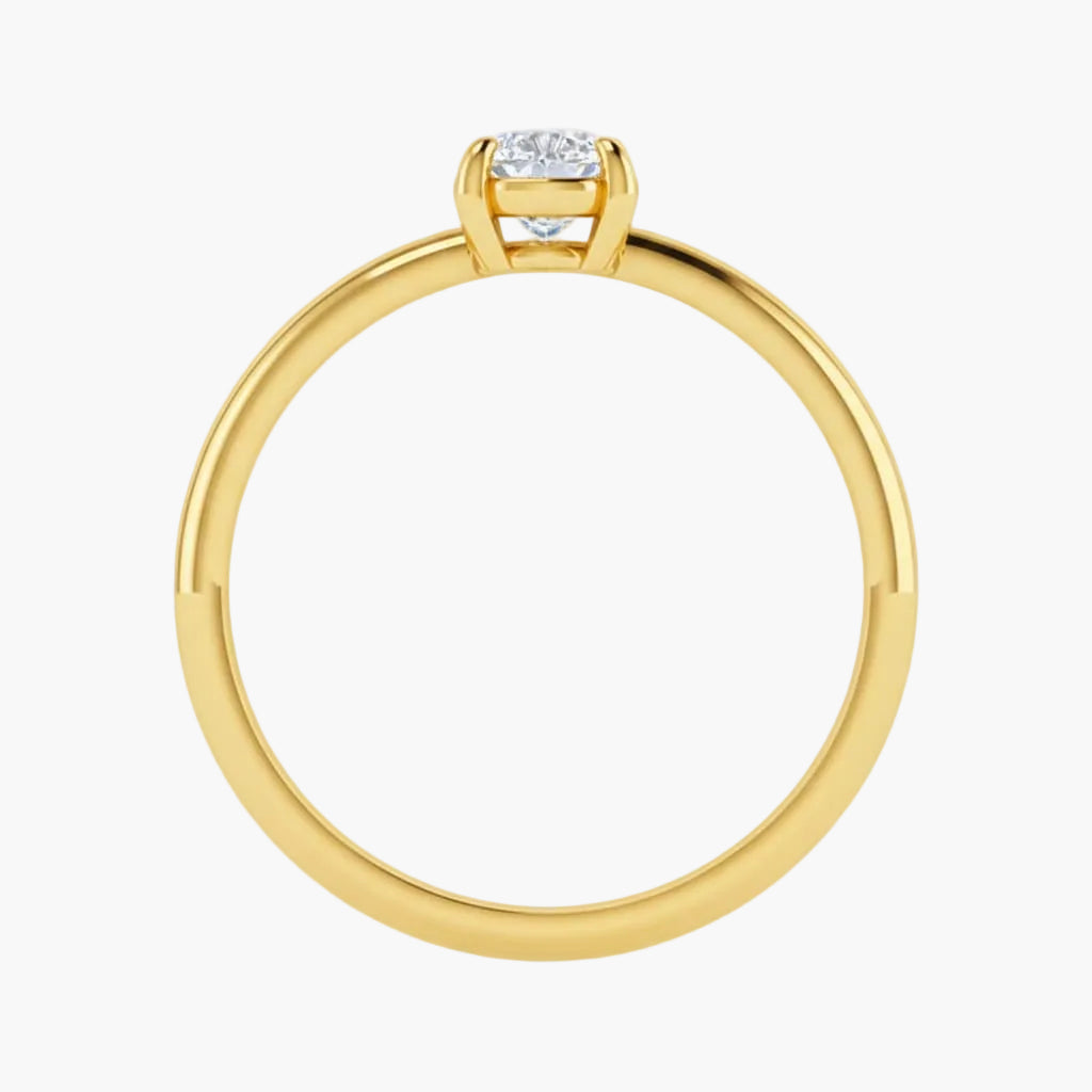 Gold ring with a diamond on a white background