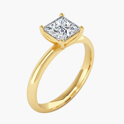 Gold ring with a large diamond on a white background