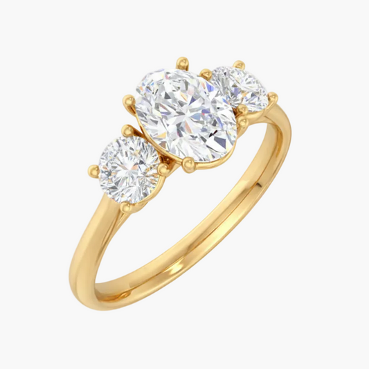 Gold ring with three diamonds on a white background