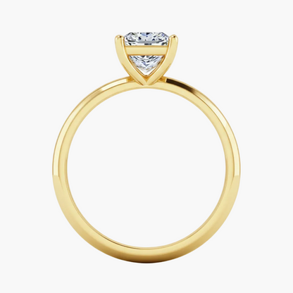 Gold ring with a diamond on a white background