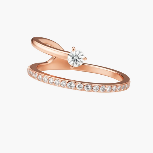Rose gold ring with diamonds on a white background