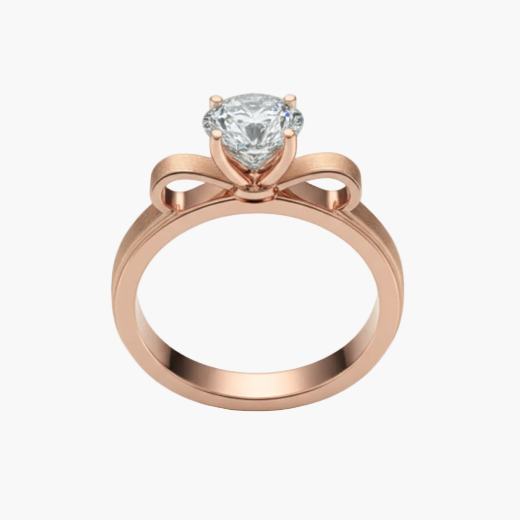 Rose gold ring with a diamond on a light gray background