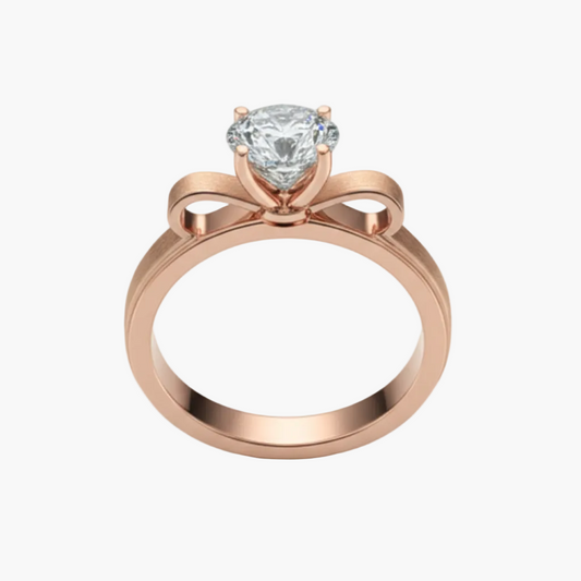 Rose gold ring with a diamond on a light gray background