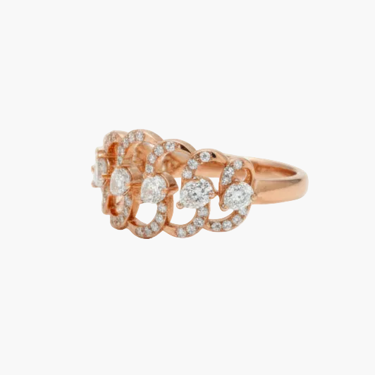 Rose gold ring with diamond accents on a white background