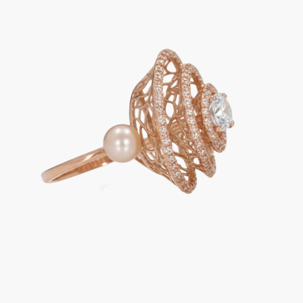 Rose gold ring with pearl and diamond on a white background