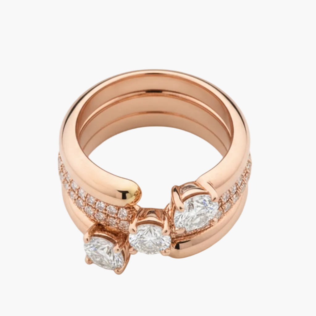 Rose gold ring with diamond accents on a light background